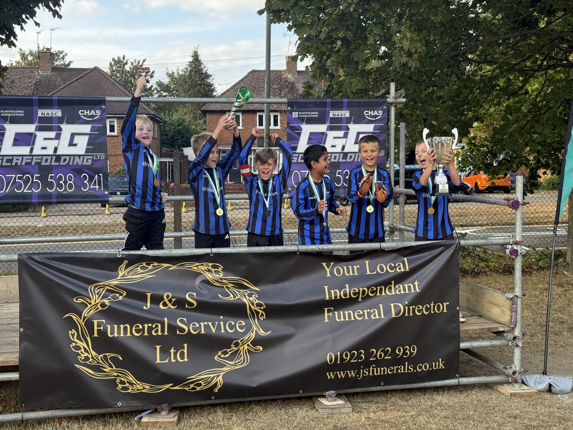 The U9 Red squad celebrate winning the Evergreen tournament